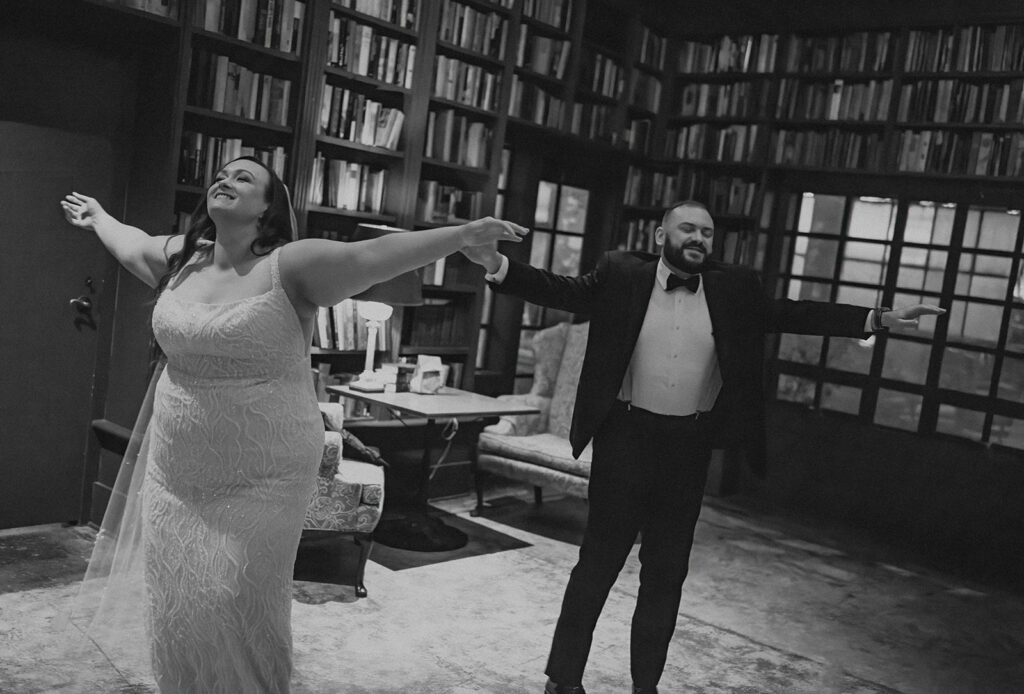 Bride and groom dance alone in library after the ceremony