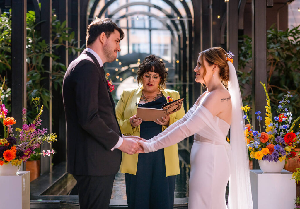 couple shares vows at europa wedding seattle
