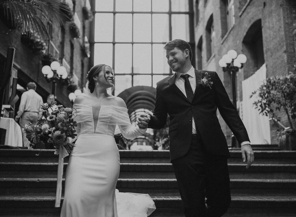 Hand in hand couple departs europa wedding seattle